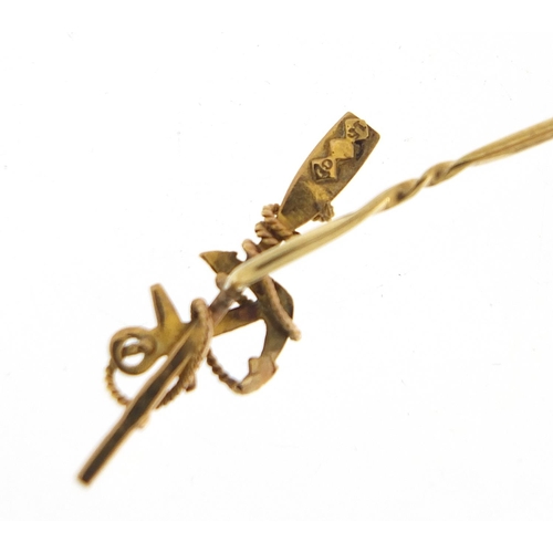 283 - Victorian maritime rowing interest 15ct gold stick pin with anchor and oar, 7.5cm in length, 1.8g