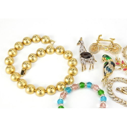 1853 - Vintage and later jewellery including bracelets set with clear stones, jewelled and enamel animal br... 