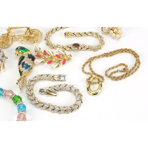 1853 - Vintage and later jewellery including bracelets set with clear stones, jewelled and enamel animal br... 