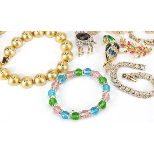 1853 - Vintage and later jewellery including bracelets set with clear stones, jewelled and enamel animal br... 