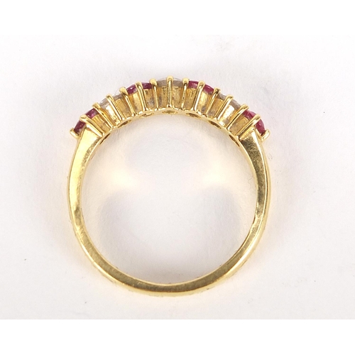 430 - 18ct gold diamond and ruby half eternity ring, the diamonds approximately 2.1mm in diameter, size N,... 