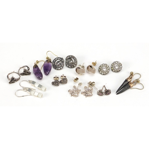 2556 - Group of silver and white metal earrings including marcasite, amethyst and horn, the largest 3cm hig... 