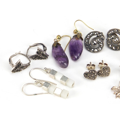 2556 - Group of silver and white metal earrings including marcasite, amethyst and horn, the largest 3cm hig... 