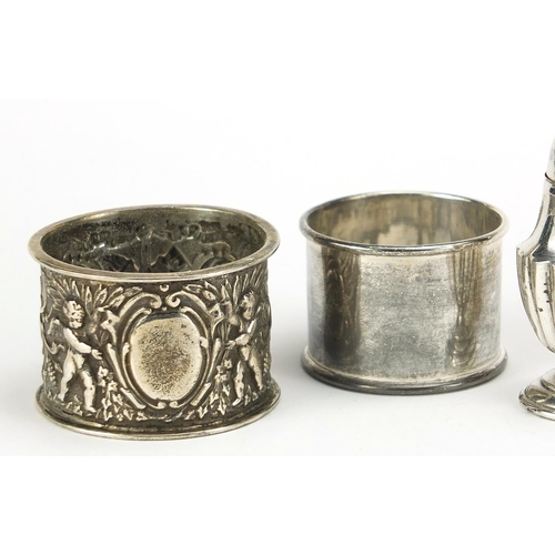 517 - Victorian and later silver objects including a napkin ring embossed with Putti and miniature casters... 