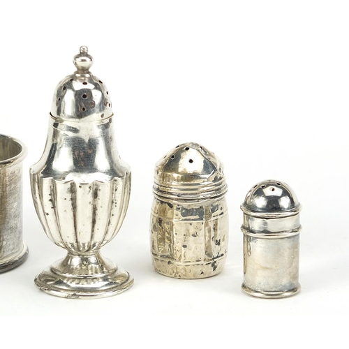 517 - Victorian and later silver objects including a napkin ring embossed with Putti and miniature casters... 