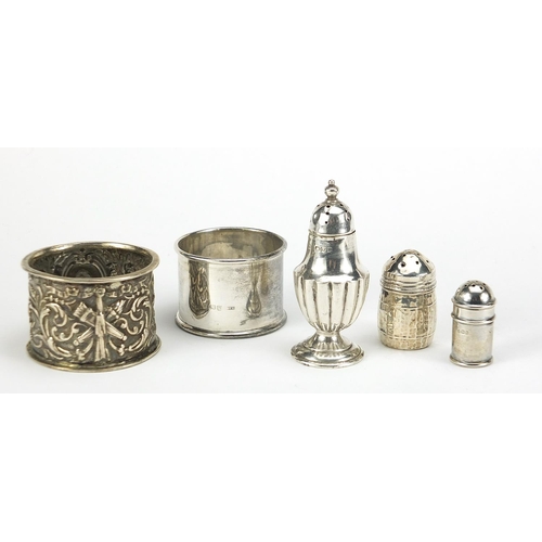 517 - Victorian and later silver objects including a napkin ring embossed with Putti and miniature casters... 