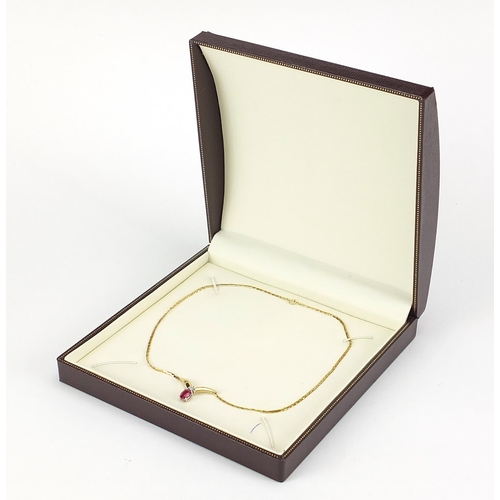 675 - 9ct gold ruby and diamond necklace, housed in a fitted box, 40cm in length, 5.5g