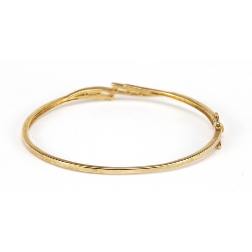 829 - 9ct gold diamond hinged bangle, 6.5cm wide, 8.3g