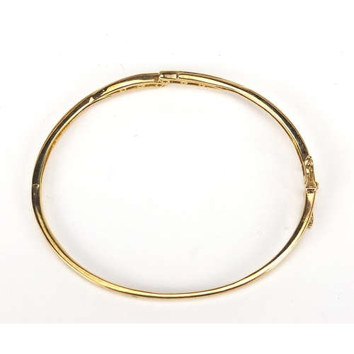 829 - 9ct gold diamond hinged bangle, 6.5cm wide, 8.3g