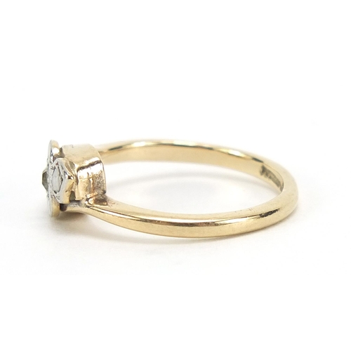 901 - 9ct gold diamond three stone crossover ring, size I, 2.0g