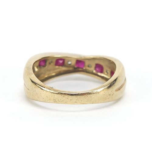 181 - 9ct gold ruby and diamond crossover half eternity ring, size J, 2.6g