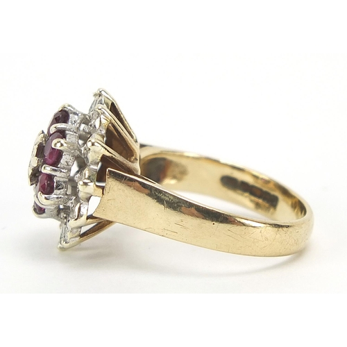 627 - 9ct gold ruby and diamond three tier cluster ring, size K, 4.5g