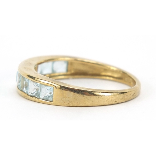 861 - 9ct gold blue stone half eternity ring, size R, 2.7g