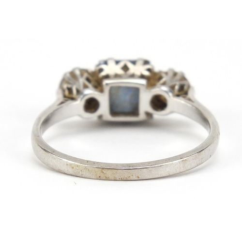 50 - Unmarked platinum sapphire and diamond ring, the sapphire approximately 6.4mm x 5.0mm, the diamonds ... 