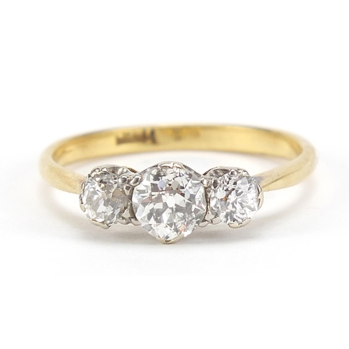8 - 18ct gold diamond trilogy ring, the central diamond approximately 4.7mm in diameter, the smaller dia... 