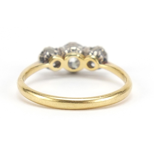 8 - 18ct gold diamond trilogy ring, the central diamond approximately 4.7mm in diameter, the smaller dia... 