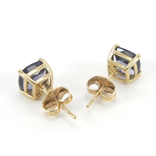 398 - Matched pair of 9ct gold purple stone stud earrings, possibly tanzanite, 6.5mm x 6.5mm, 1.3g