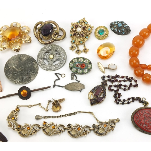 1815 - Antique and later jewellery including a Victorian gilt metal amethyst brooch, amber coloured necklac... 