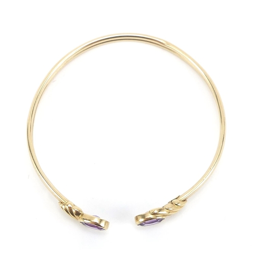 180 - 9ct gold amethyst bangle, 5.5cm in diameter, 6.4g