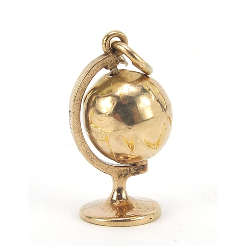 565 - 9ct gold rotating globe charm, 1.7cm high, 1.7g