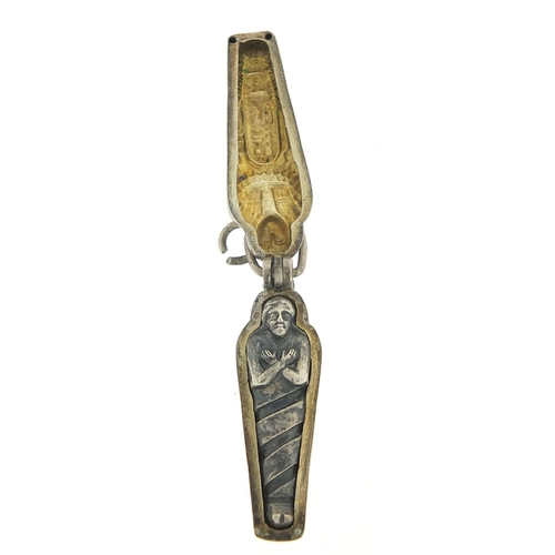 213 - Egyptian Revival silver and enamel Tutankhamun Sarcophagus pendant enclosing a mummy, 2.8cm high, 3.... 