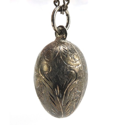 1856 - Silver engraved egg pendant on a sterling silver necklace, 4cm high and 56cm in length, total 19.0g