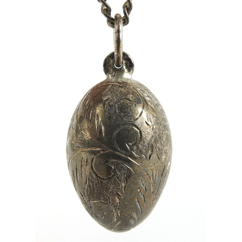 1856 - Silver engraved egg pendant on a sterling silver necklace, 4cm high and 56cm in length, total 19.0g