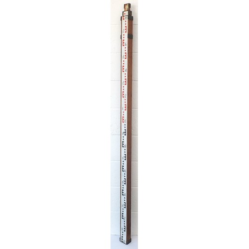 2581 - Brass mounted surveyor's level, 190.5cm in length