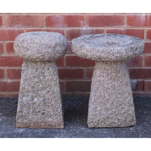 2596 - Two stoneware garden stands/tables, possibly granite, the largest 41cm high