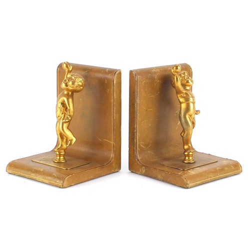 36 - Pair of tooled leather and gilt metal Putti design bookends, each 17cm high