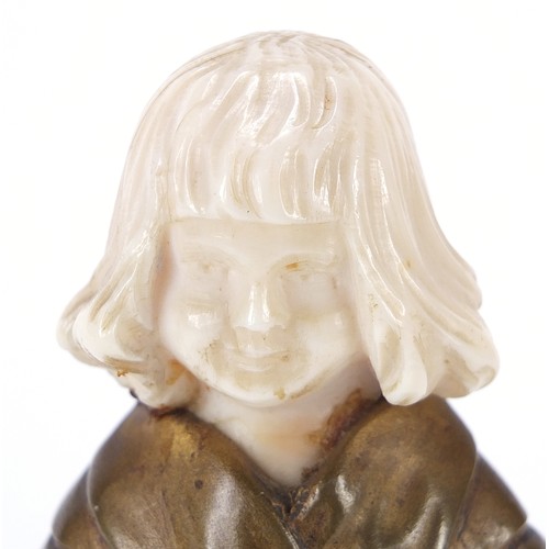 16 - Art Deco gilt bronze and ivory figurine of a young girl holding a spoon and bucket, raised on a squa... 