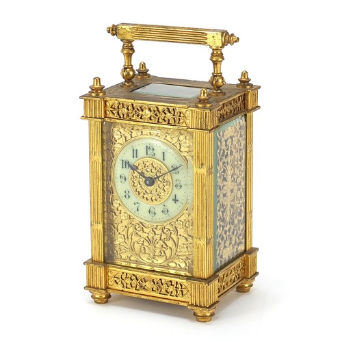 77 - 19th century gilt brass carriage clock with foliate fret panels and enamelled chapter ring having Ar... 