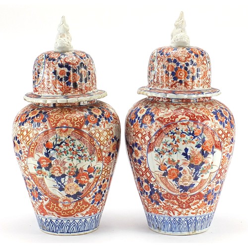 60 - Large pair of Japanese Imari lidded porcelain vases, each profusely hand painted with flowers, 45cm ... 