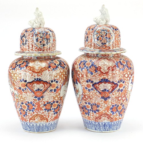 60 - Large pair of Japanese Imari lidded porcelain vases, each profusely hand painted with flowers, 45cm ... 