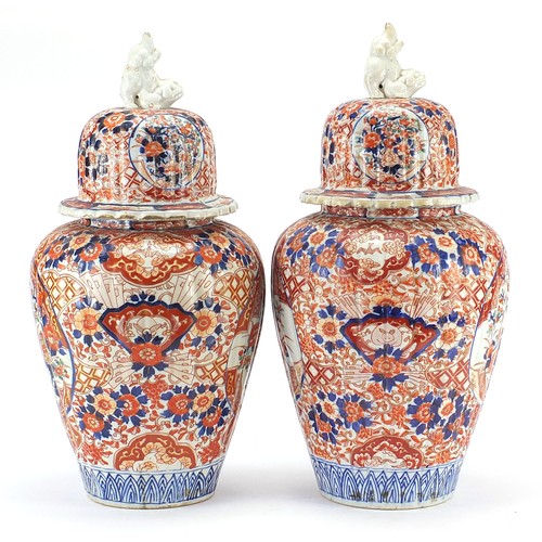 60 - Large pair of Japanese Imari lidded porcelain vases, each profusely hand painted with flowers, 45cm ... 