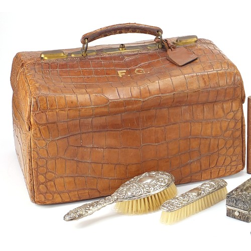 139 - Drew & Sons, Victorian crocodile skin travelling vanity case with a selection of silver mounted cut ... 