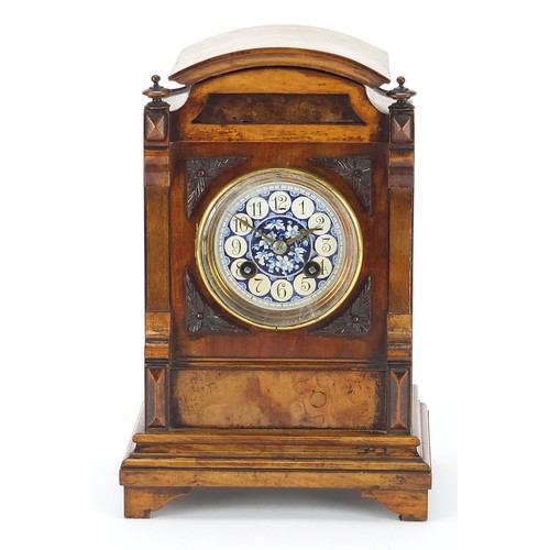 686 - 19th century walnut mantle clock with foliate dial having Arabic numerals, the movement numbered 181... 