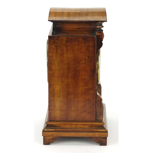 686 - 19th century walnut mantle clock with foliate dial having Arabic numerals, the movement numbered 181... 