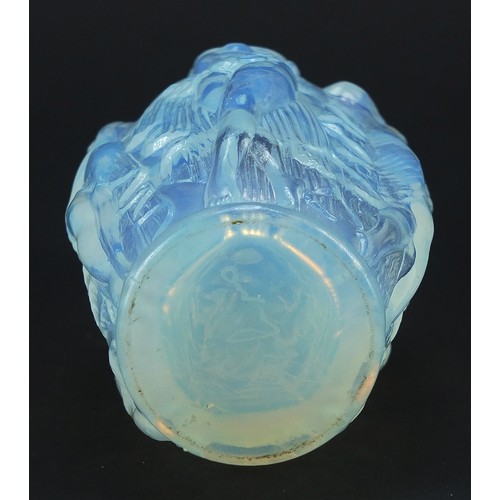 667 - Art Deco opalescent glass scent bottle decorated in relief with five semi nude maidens, 16cm high