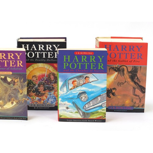 1887 - Seven Harry Potter books including paperback Philosopher's Stone, first edition Deathly Hallows, fir... 