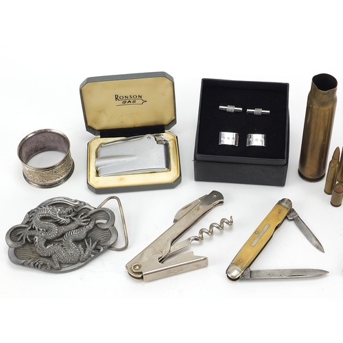 1888 - Objects including a Ronson lighter with box, heavy dragon belt buckle, military interest ammunition ... 