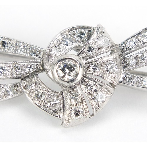 698 - Good unmarked white gold diamond bow brooch, 5cm wide, 5.7g