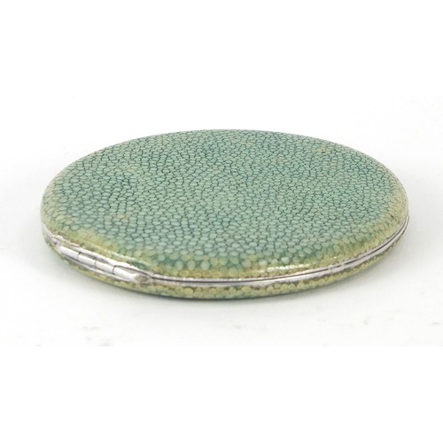 124 - Antique white metal and shagreen mounted powder compact housed in a Chamois leather case, 9.5cm in l... 