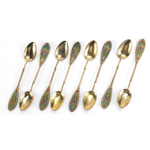 669 - Johan G Kjaerland, set of eight Norwegian silver gilt and plique à jour enamel teaspoons housed in a... 