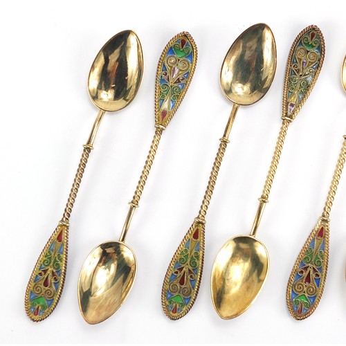 669 - Johan G Kjaerland, set of eight Norwegian silver gilt and plique à jour enamel teaspoons housed in a... 