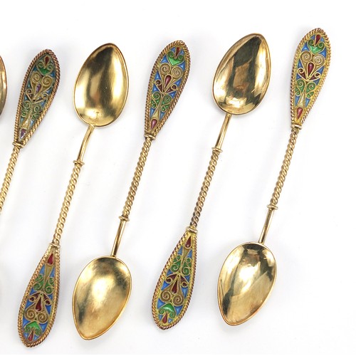 669 - Johan G Kjaerland, set of eight Norwegian silver gilt and plique à jour enamel teaspoons housed in a... 