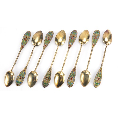 669 - Johan G Kjaerland, set of eight Norwegian silver gilt and plique à jour enamel teaspoons housed in a... 