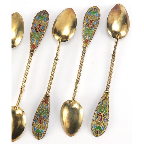 669 - Johan G Kjaerland, set of eight Norwegian silver gilt and plique à jour enamel teaspoons housed in a... 