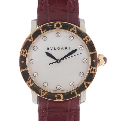 1135 - Bvlgari, 18ct gold automatic ladies wristwatch with diamond set mother of pearl dial and cabochon pu... 