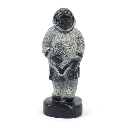 1002 - Boma, Canadia Inuit carving of an Eskimo holding a doll, 21cm high